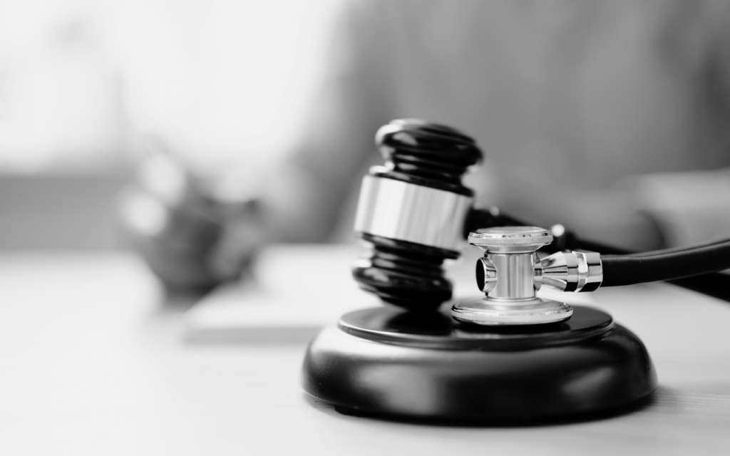 Gavel next to a stethoscope symbolizing medical negligence.