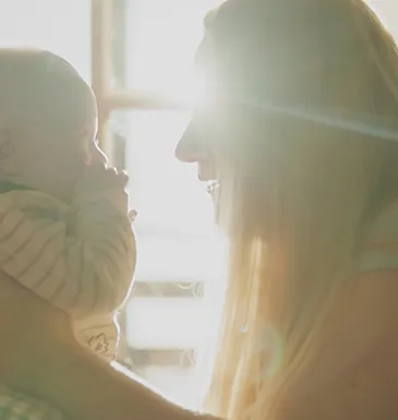 Woman holding an injured baby